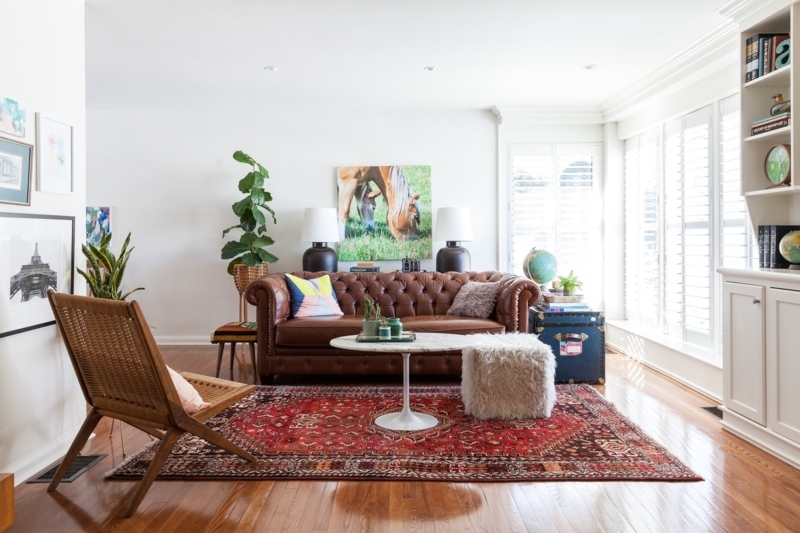 Tufted Leather Chesterfield Sofa with Vibrant Red Persian-Style Rug