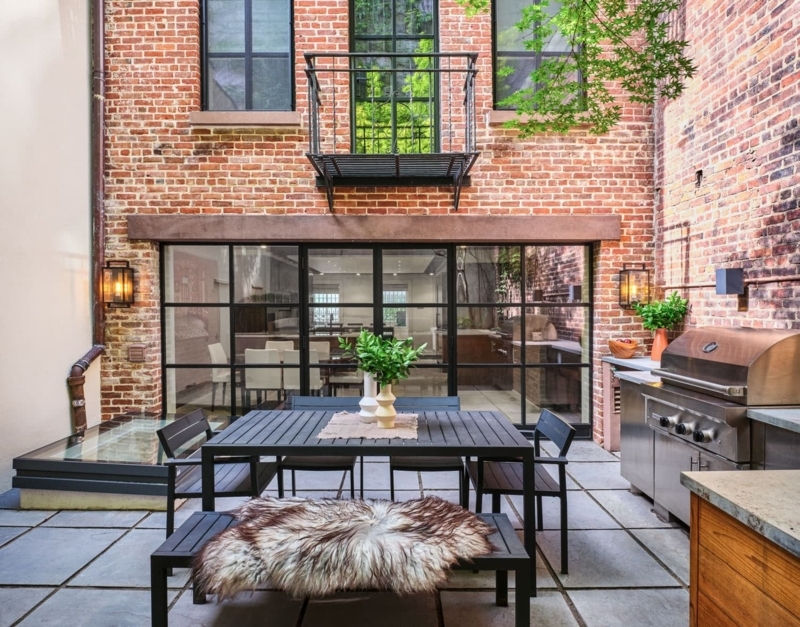 Urban Brick Patio Dining Set with Modern Black Grid Patio Doors