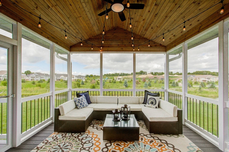 Vaulted Wood Ceiling Porch with String Lights & U-Shaped Sectional.