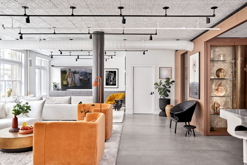 Vibrant Eclectic Loft Tin Ceiling Orange Velvet Concrete Floor