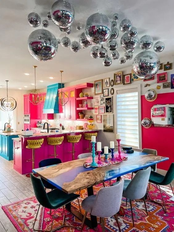 Vibrant Kitchen with Hot Pink Cabinets and Disco Ball Ceiling