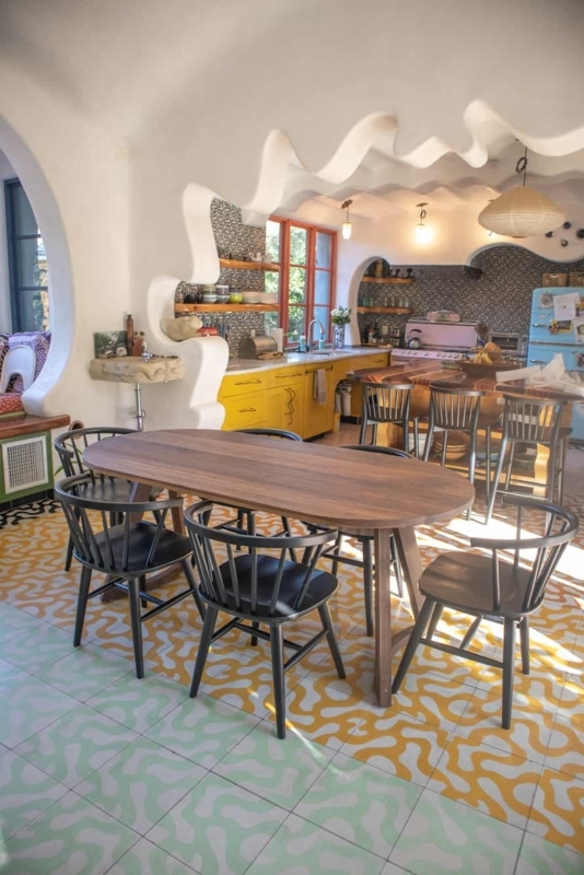 Walnut Racetrack Dining Table: Organic Archway & Patterned Floor Tile