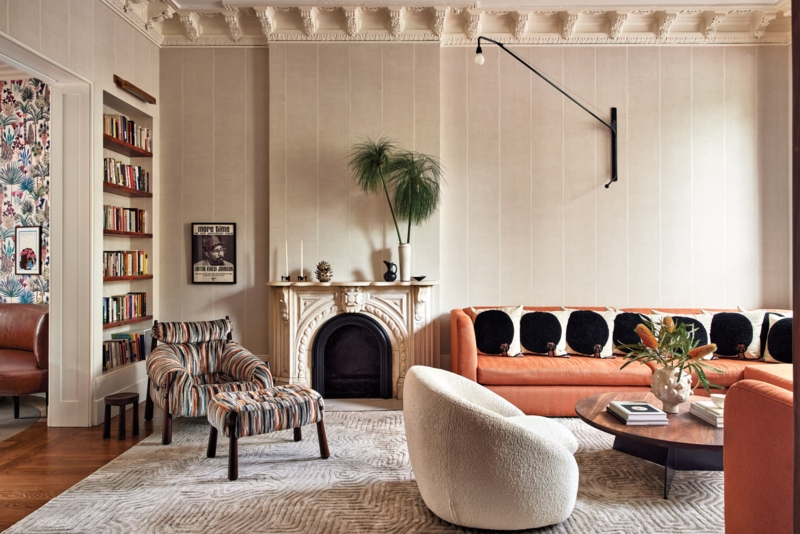 Warm Orange Living Room Decor With Sculptural Bouclu00e9 Chair Styling