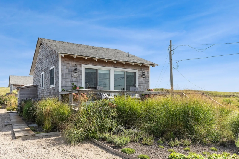 Weathered Shingle Beach Cottage with Lush Grass Landscaping