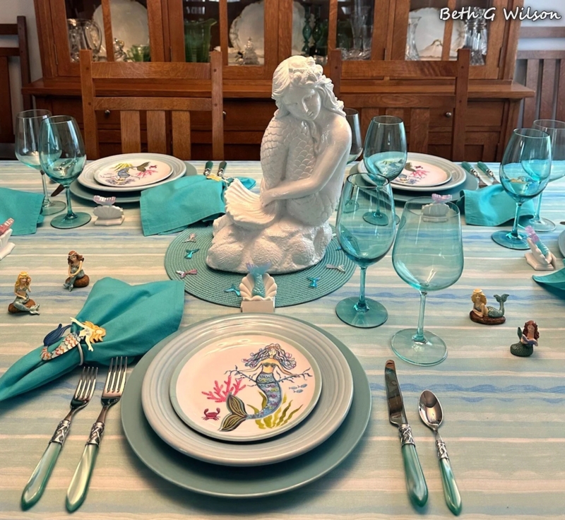 Whimsical Tablescape White Mermaid Centerpiece Teal Tinted Stemware