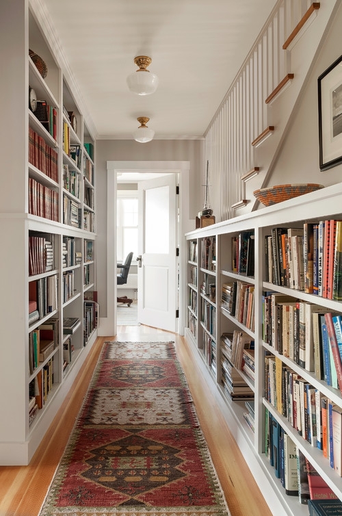 White Built-In Hallway Bookshelves with Patterned Runner Rug