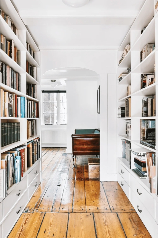 White Hallway Built-ins with Integrated Storage Drawers and Arch