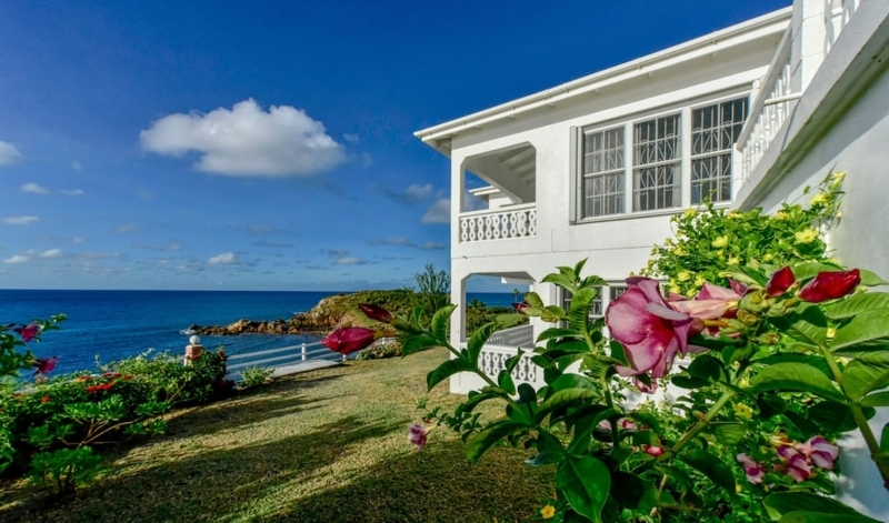 White Oceanfront Villa Exterior Tiered Balconies Tropical Flora