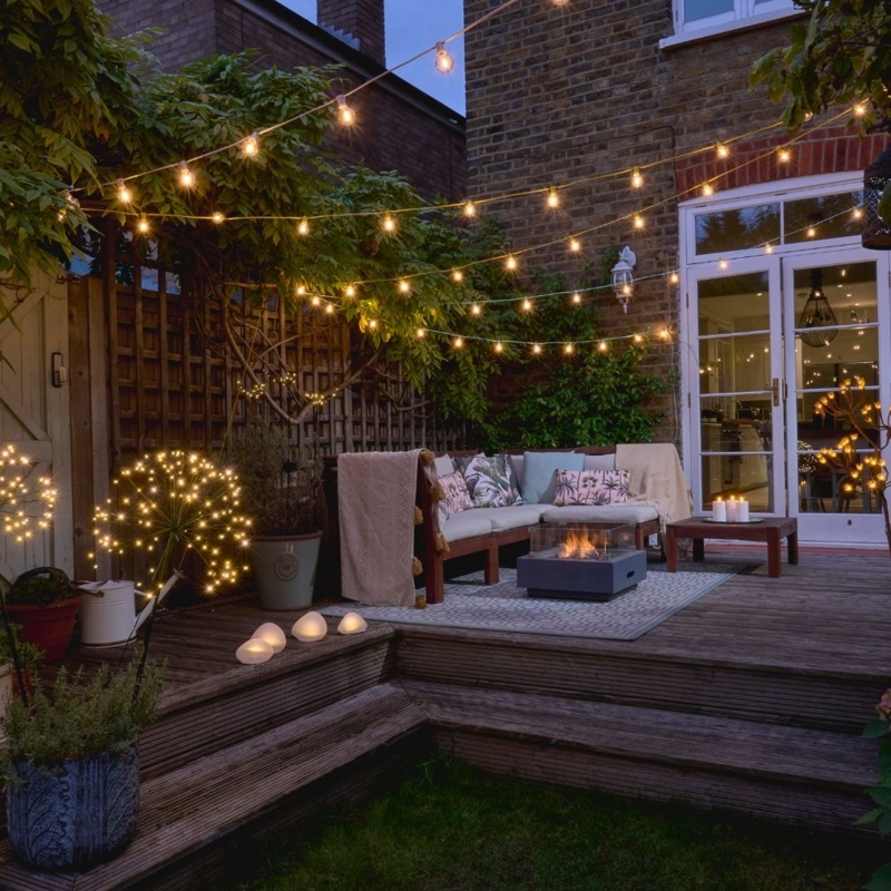Wood Deck with Firework Light Sculptures & Warm Outdoor String Lighting