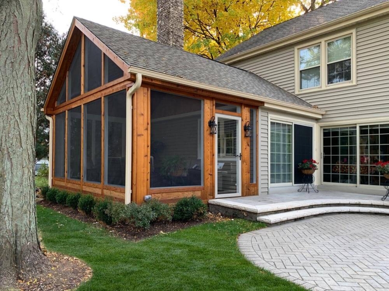 Wood Frame Screened Porch with Herringbone Paver Patio & Curved Steps.