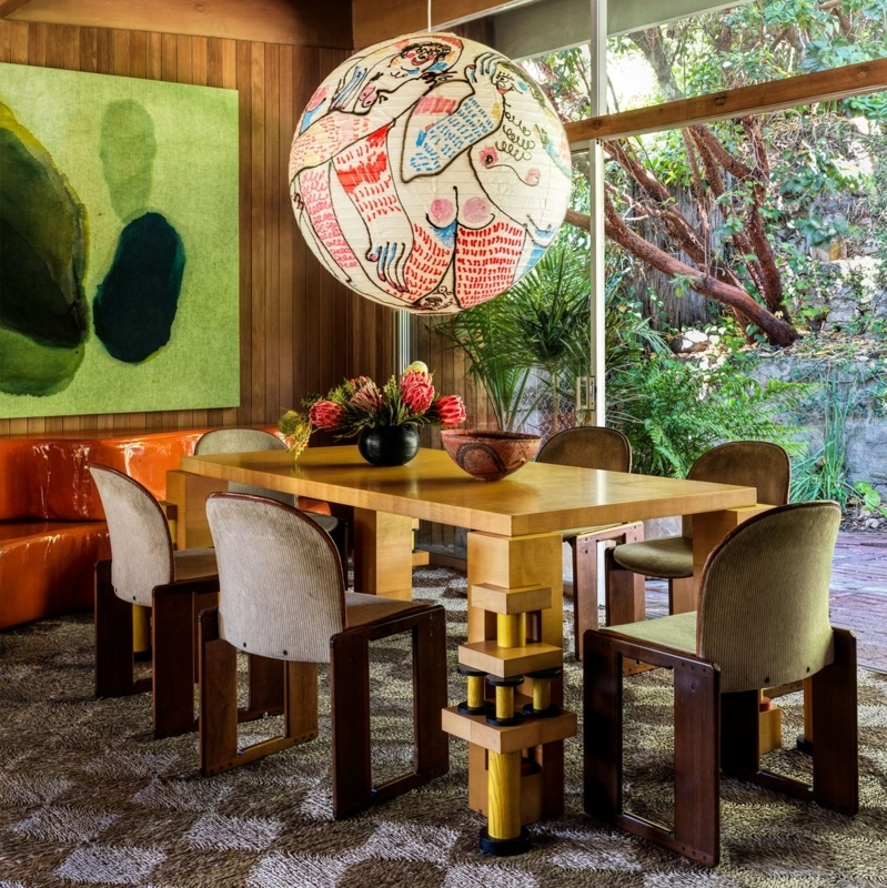 Wood Paneled Dining Space: Sculptural Chairs & Oversized Graphic Lantern