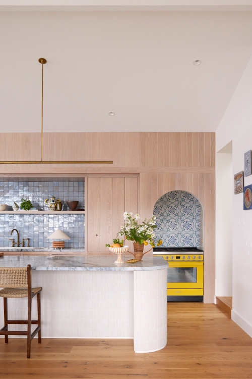 Yellow Range Stove Kitchen: Blue Tiled Arch & Curved Island