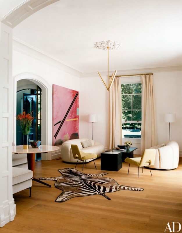 Zebra Hide Rug Accent in Modern Living Room with Curved Sofa