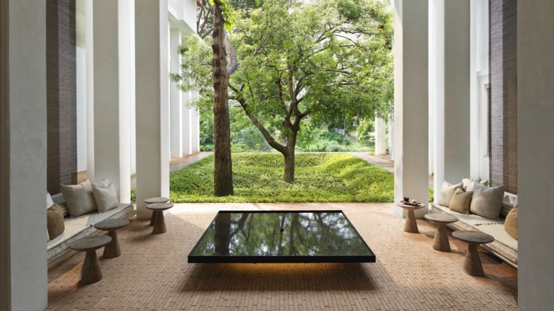 Zen Courtyard Lounge: Reflecting Pool, Brick Flooring, White Pillars